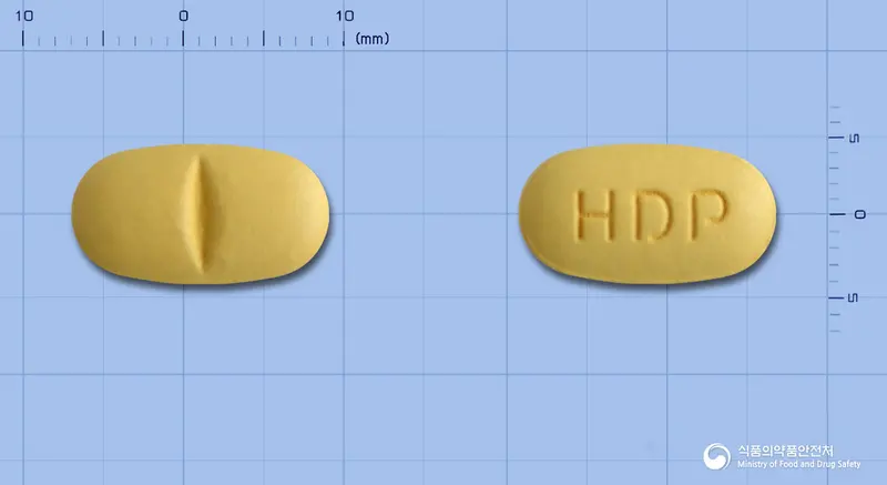 알세핀정(콜린알포세레이트) 앞뒤 사진 (주황색 타원형, 각인 HDP)