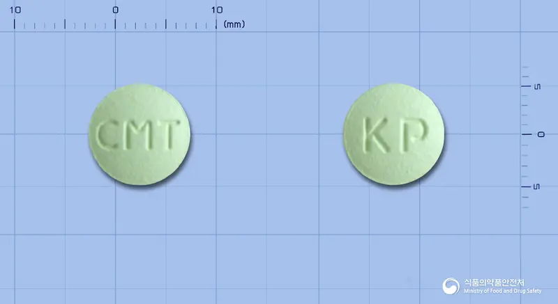 파마시메티딘정200밀리그램(시메티딘) 앞뒤 사진 (연두색 원형, 각인 CMT / KP)