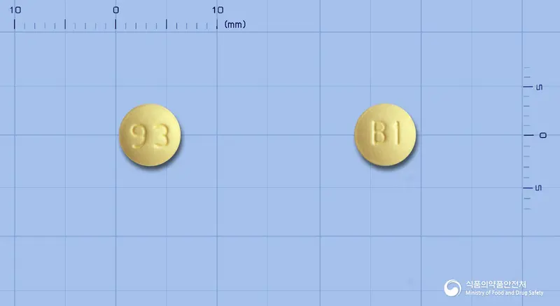 테바레트로졸정2.5밀리그램 앞뒤 사진 (노란색 원형, 각인 93 / B1)