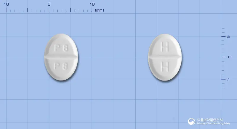 미라프정0.5밀리그램(프라미펙솔염산염일수화물) 앞뒤 사진 (흰색 타원형, 각인 P8 P8 / H H)