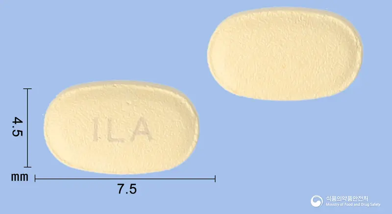 일라정5mg(타다라필) 앞뒤 사진 (주황색 타원형, 각인 ILA)