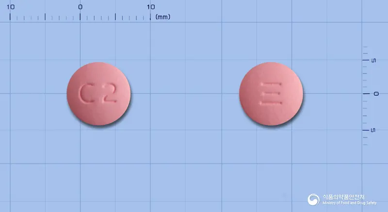 크레지정20밀리그램(로수바스타틴칼슘) 앞뒤 사진 (분홍색 원형, 각인 C2)
