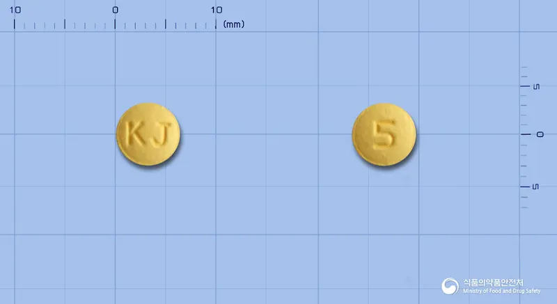 빅토리스정5밀리그램(타다라필) 앞뒤 사진 (노란색 원형, 각인 KJ / 5)