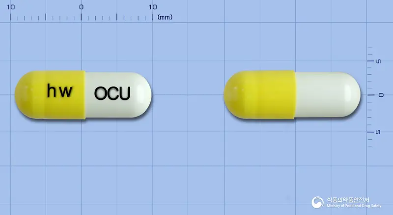 원큐어캡슐 앞뒤 사진 (노란색 캡슐, 각인 hw OCU)