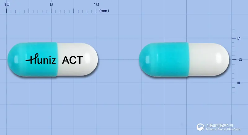 휴니즈아세틸시스테인캡슐200mg 앞뒤 사진 (파란색 캡슐, 각인 ACT)