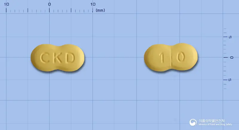 센돔정10밀리그램(타다라필) 앞뒤 사진 (노란색 기타, 각인 CKD / 1 0)