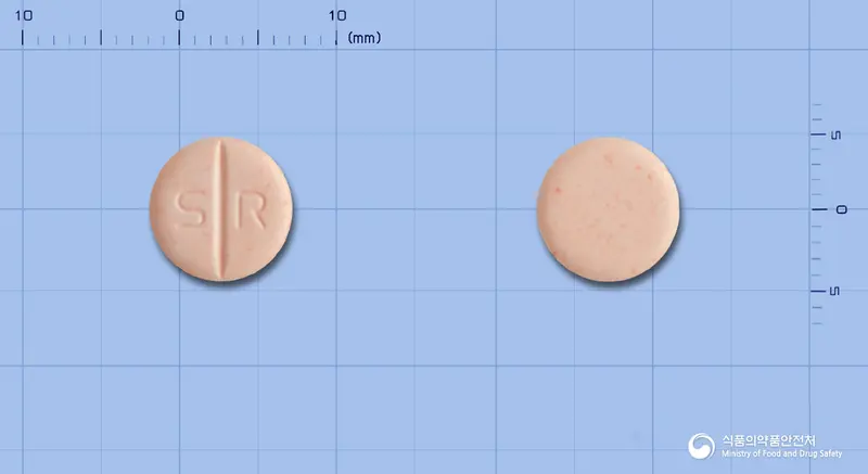 렙토정(스트렙토키나제·스트렙토도르나제) 앞뒤 사진 (분홍색 원형, 각인 S R)
