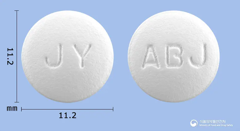 알비진정 앞뒤 사진 (흰색 원형, 각인 JY / ABJ)