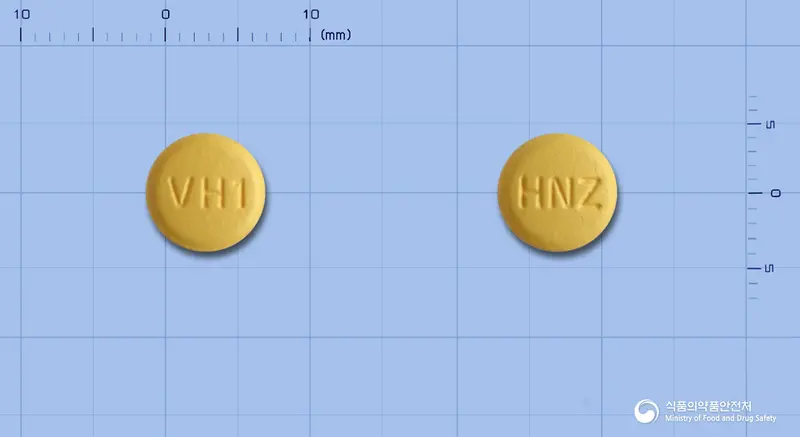 휴니즈발사르핀정5/80mg(암로디핀, 발사르탄) 앞뒤 사진 (주황색 원형, 각인 VH1 / HNZ)