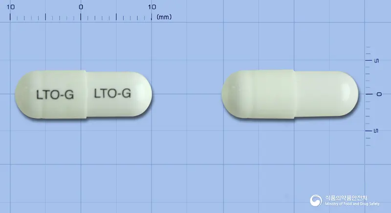 락토민지캡슐(바실루스리케니포르미스균) 앞뒤 사진 (흰색 캡슐, 각인 LTO-G LTO-G)