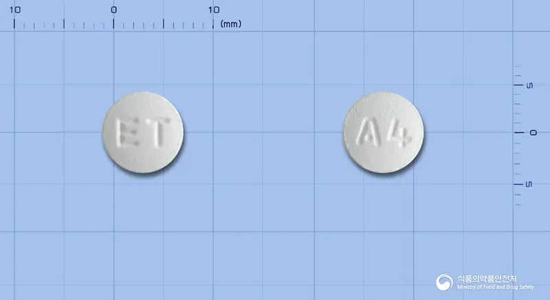 레프렉스정100mg(레보플록사신수화물) 앞뒤 사진 (흰색 원형, 각인 ET / A4)