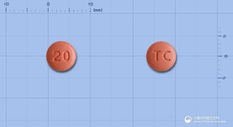 에소리움정20mg(에스오메프라졸마그네슘이수화물)(수출명 : FRIGERD tablet 20mg) 앞뒤 사진 (분홍색 원형, 각인 20 / TC)