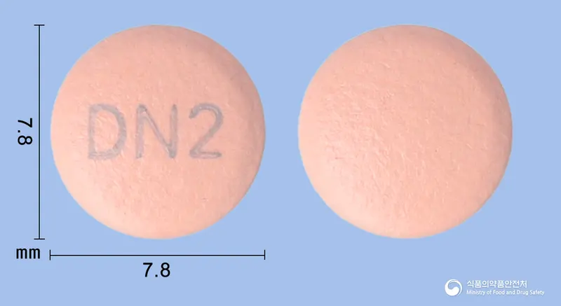 에스오엠정20mg(에스오메프라졸마그네슘삼수화물) 앞뒤 사진 (분홍색 원형, 각인 DN2)
