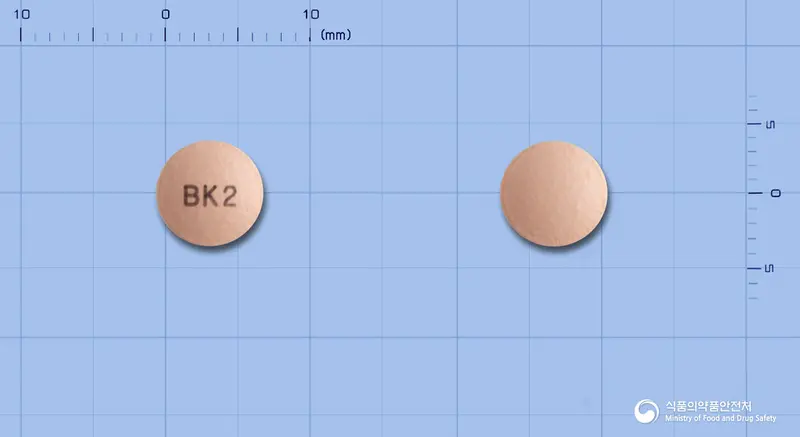 부소메졸정20mg(에스오메프라졸마그네슘삼수화물) 앞뒤 사진 (분홍색 원형, 각인 BK2)