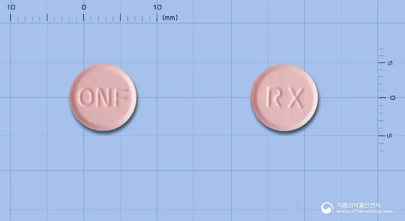 오노펜정(록소프로펜나트륨수화물) 앞뒤 사진 (분홍색 원형, 각인 ONF / RX)