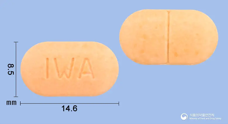 모아졸정(알벤다졸) 앞뒤 사진 (분홍색 장방형, 각인 IWA)