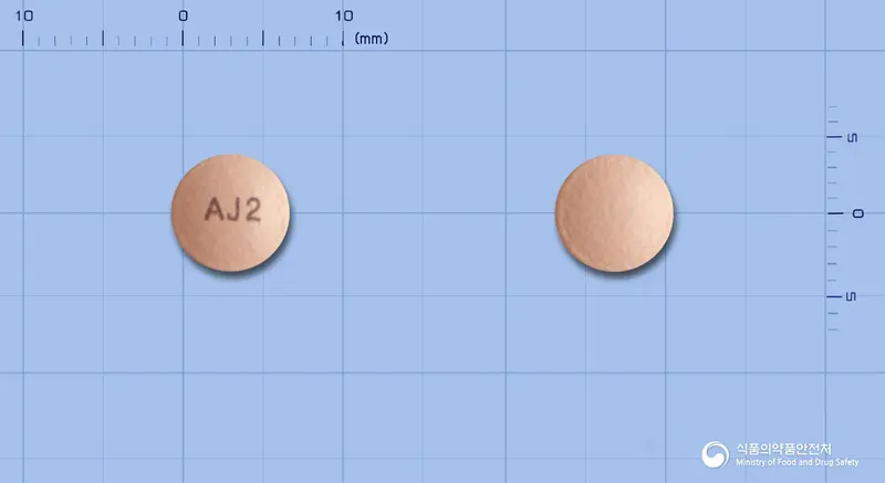 아나프라졸정20밀리그램(에스오메프라졸마그네슘삼수화물) 앞뒤 사진 (분홍색 원형, 각인 AJ2)