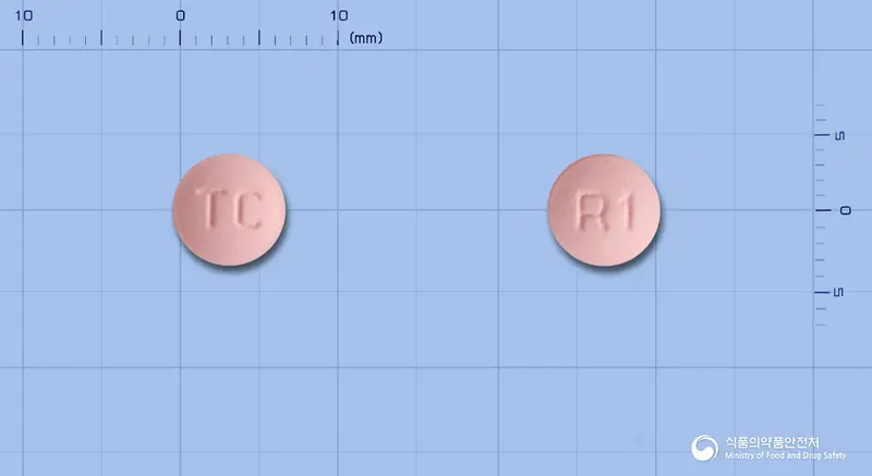 로바이드정10mg(로수바스타틴칼슘) 앞뒤 사진 (분홍색 원형, 각인 TC / R1)