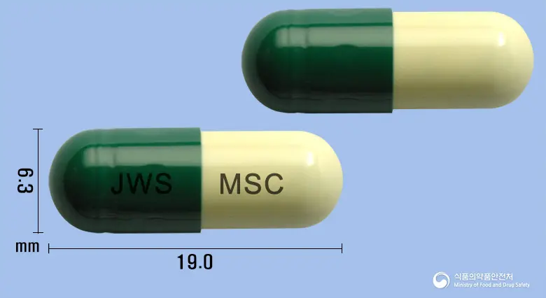 모나에스캡슐 앞뒤 사진 (초록색 캡슐, 각인 JWS MSC)
