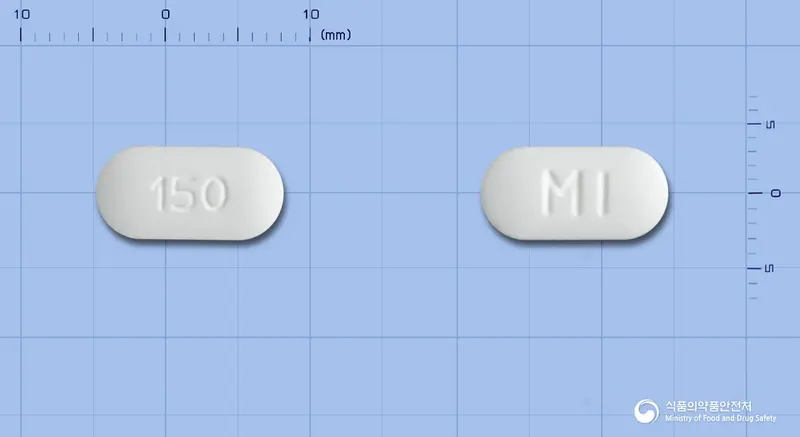 큐로켈서방정150밀리그램(쿠에티아핀푸마르산염) 앞뒤 사진 (흰색 장방형, 각인 150 / MI)