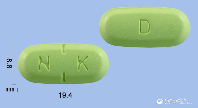 넥시나디정 앞뒤 사진 (연두색 타원형, 각인 N K / D)