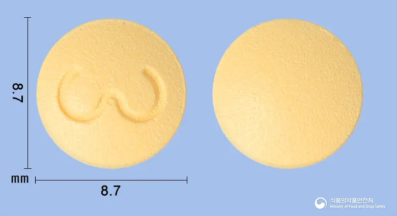 세로아핀정100mg(쿠에티아핀푸마르산염) 앞뒤 사진 (주황색 원형)