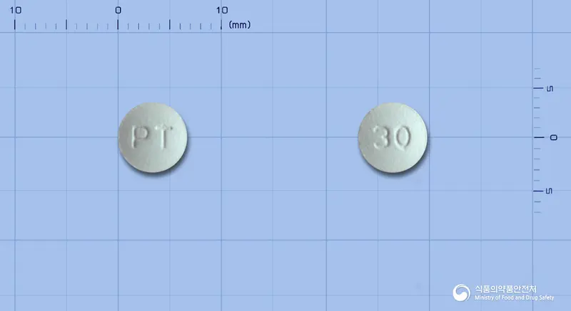 타폭센정30밀리그램(다폭세틴염산염) 앞뒤 사진 (회색 원형, 각인 PT / 30)