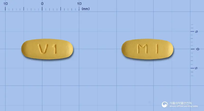 에스살탄정5/160mg(수출용) 앞뒤 사진 (주황색 타원형, 각인 V1 / MI)