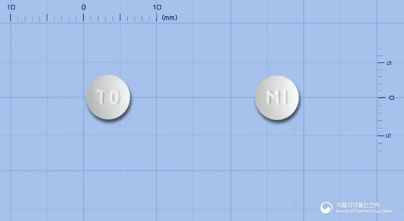 밀타오디정7.5밀리그램(미르타자핀) 앞뒤 사진 (흰색 원형, 각인 T0 / MI)