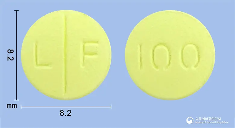 로맥사신정100mg(로메플록사신염산염) 앞뒤 사진 (노란색 원형, 각인 L F / 100)