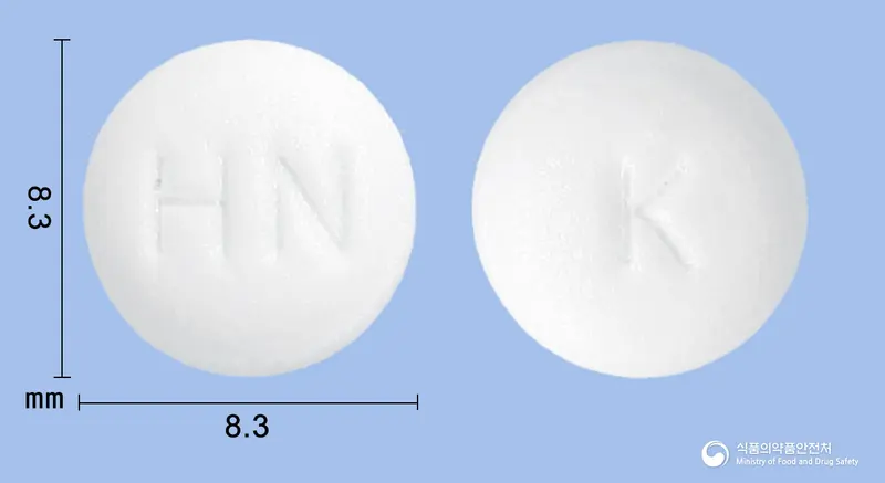 칼리딘정(칼리디노게나제) 앞뒤 사진 (흰색 원형, 각인 HN / K)
