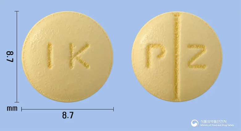 도네펙트정10mg(도네페질염산염수화물) 앞뒤 사진 (노란색 원형, 각인 IK / P Z)