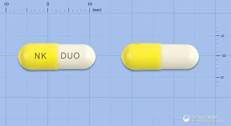 듀오레캡슐 앞뒤 사진 (노란색 캡슐, 각인 NK DUO)