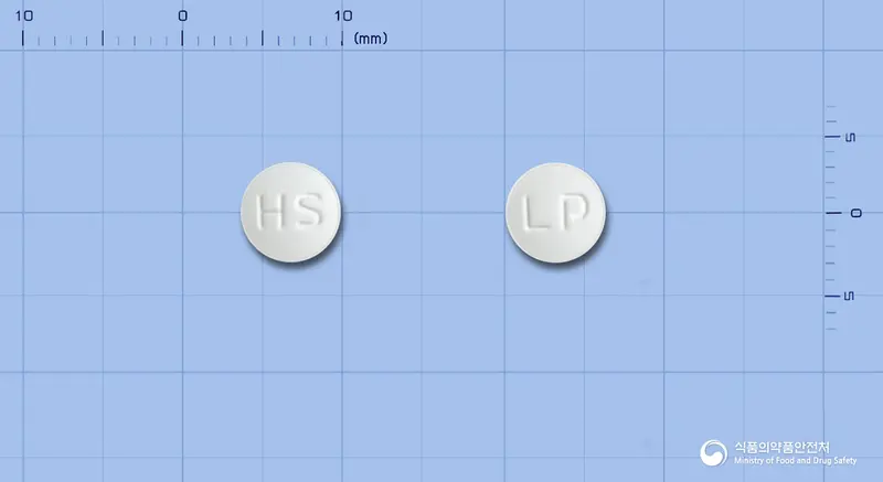 오프몬정(리마프로스트알파덱스) 앞뒤 사진 (흰색 원형, 각인 HS / LP)