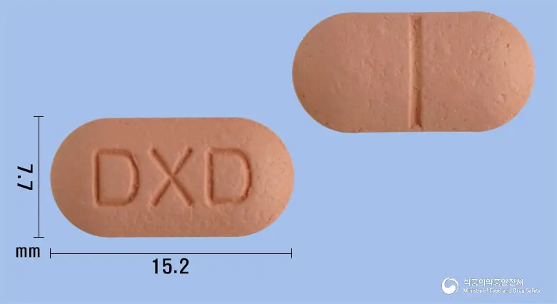 덱시딜정400mg(덱시부프로펜디.씨.) 앞뒤 사진 (분홍색 장방형, 각인 DXD)