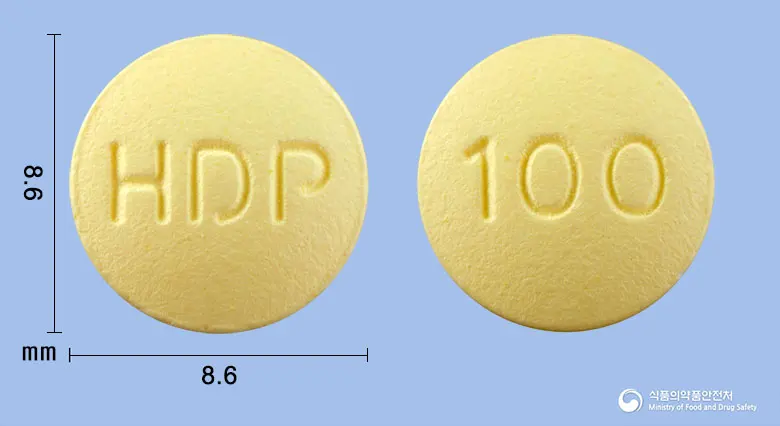쎄로티핀정100밀리그램(쿠에티아핀푸마르산염) 앞뒤 사진 (노란색 원형, 각인 HDP / 100)