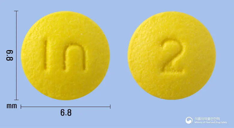 비보존라베프라졸정20mg(라베프라졸나트륨) 앞뒤 사진 (노란색 원형, 각인 I∩ / 2)