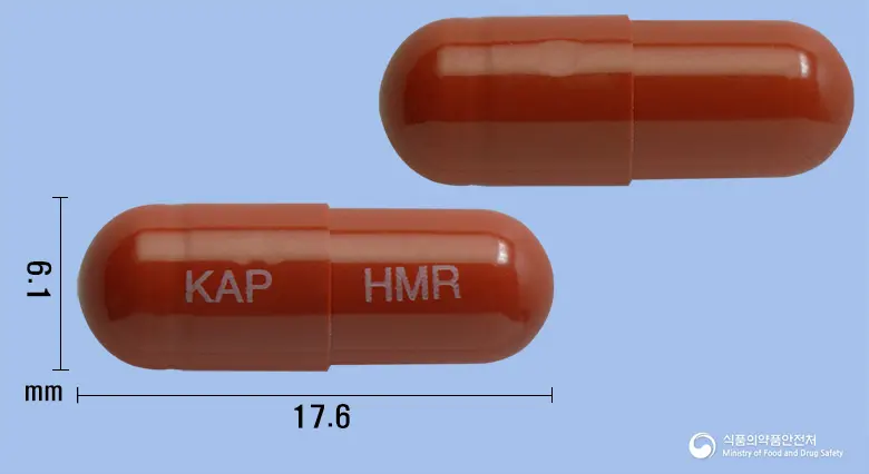 헤모락에이캡슐 앞뒤 사진 (갈색 캡슐, 각인 KAP HMR)