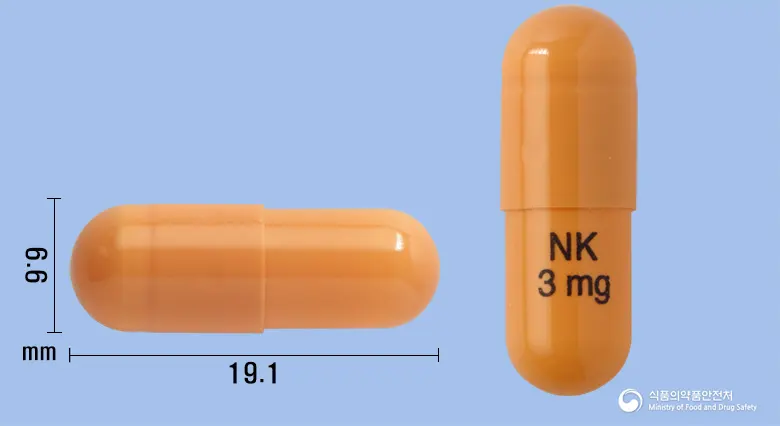 넥티민캡슐3mg(리바스티그민타르타르산염) 앞뒤 사진 (주황색 캡슐, 각인 NK3mg)