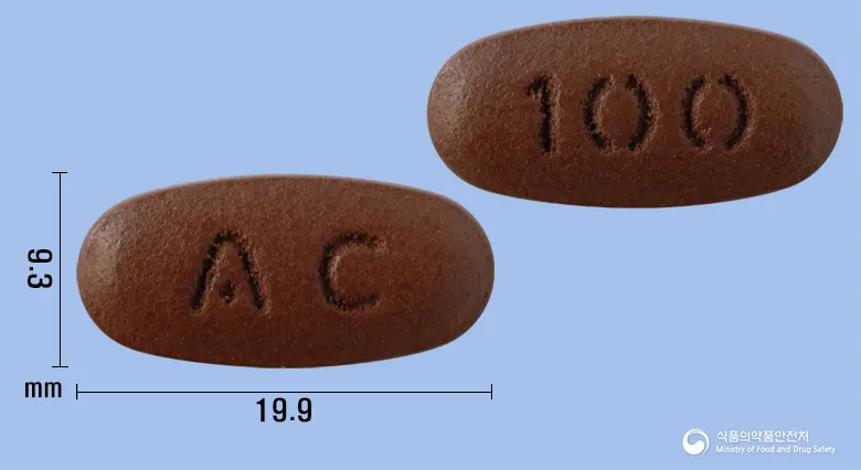 비백파워정 앞뒤 사진 (갈색 타원형, 각인 AC / 100)