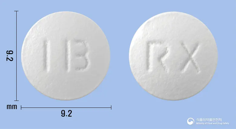 록트로신정(록시트로마이신) 앞뒤 사진 (흰색 원형, 각인 RX)