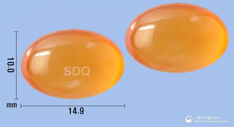 세다큐콜드연질캡슐 앞뒤 사진 (주황색·투명 캡슐, 각인 SDQ)