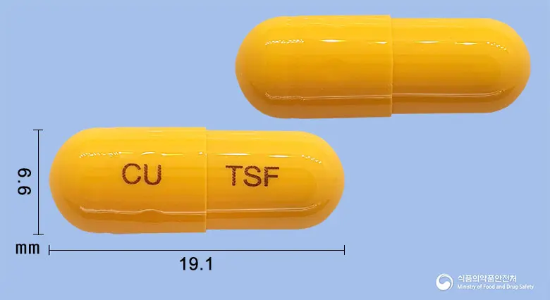 티스탑에프캡슐 앞뒤 사진 (노란색 캡슐, 각인 CU TSF)