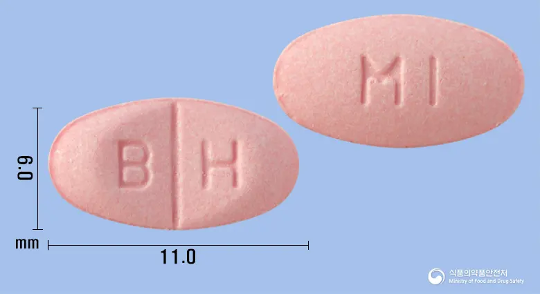 유턴정24mg(베타히스틴염산염) 앞뒤 사진 (분홍색 타원형, 각인 B H / MI)