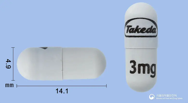 닌라로캡슐3밀리그램(익사조밉시트레이트) 앞뒤 사진 (회색 캡슐, 각인 3mg)