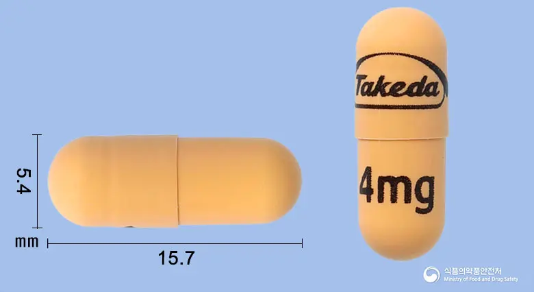닌라로캡슐4밀리그램(익사조밉시트레이트) 앞뒤 사진 (주황색 캡슐, 각인 4mg)