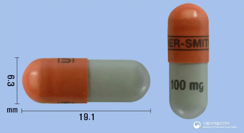 큐덱시서방캡슐100밀리그램(토피라메이트) 앞뒤 사진 (갈색 캡슐, 각인 ------------UPSHER-SMITH------------ 100mg)