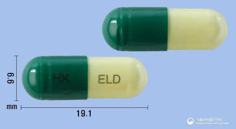 엘로인캡슐(에르도스테인) 앞뒤 사진 (초록색 캡슐, 각인 HK ELD)