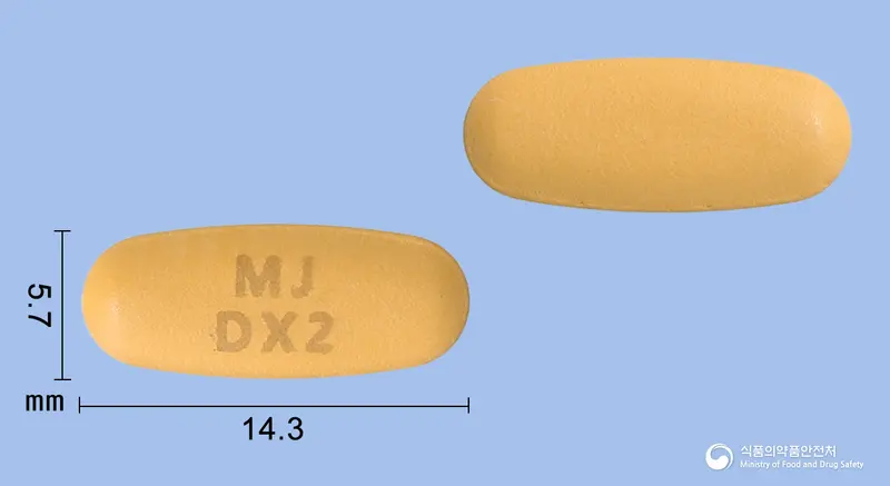 듀얼엑스정5/160mg 앞뒤 사진 (주황색 타원형, 각인 MJDX2)