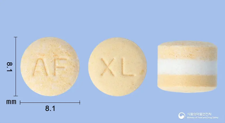 자트론엑스엘정(알푸조신염산염) 앞뒤 사진 (흰색·노란색 원형, 각인 AF / XL)